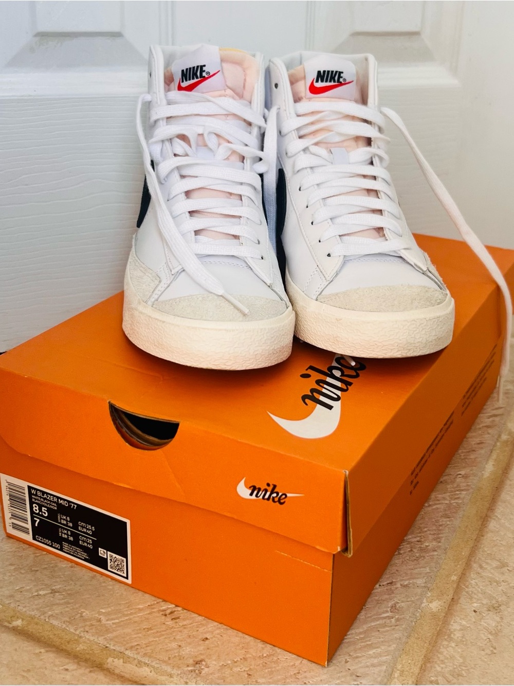 Nike Blazer Mid ‘77 White High-Top Sneakers with Black Swoosh